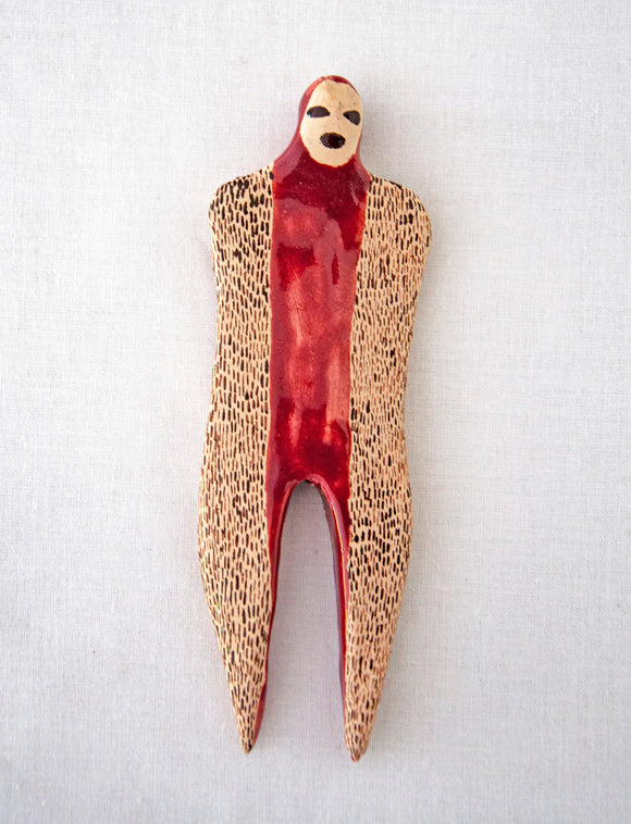 Elham Hemmat's 'Docile Bodies 9', a ceramic figure ornamented with patterns. Colours include sienna, umber and cream.