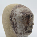 Sally Fitchard's 'Mottle'. A small ceramic head with a mottled face. DETAIL