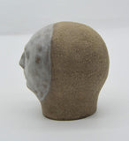 Sally Fitchard's 'Mr Silver'. A small ceramic head with a white face. LEFT PROFILE II