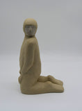 Side profile of one kneeling figure as part of Sally Fitchard's 'Multiple Kneels (Telling)'.