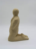 Side profile of third kneeling figure as part of Sally Fitchard's 'Multiple Kneels (Telling)'.