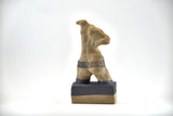 Title: Plinth Woman Artist: Sally Fitchard Medium: clay sculpture Size: 21.5 cm x 11 cm x 7.2 cm (back view). Colour comprises sand and charcoal