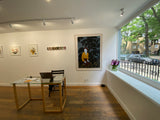 Photo of Maureen Nathan's 'The Orchard' in its frame. The piece is mounted in a white wooden frame and set behind glass
