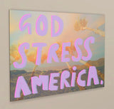 ANGLE SHOT Dan Jamieson's 'God Stress America' is a digital artwork printed on alluminium. The background derives from photos taken on a 35mm style disposable camera while on a trip to Palm Springs during the 2024 election week. Jamieson has embellished the photograph with his trademark play-on-words, altering the well-known slogan 'God Bless America' to 'God Stress America'. 