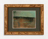 Framed abstract artwork with a wooden frame on a white wall