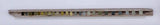 Long, narrow wooden object with a patterned surface on a white background