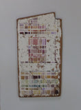 Abstract gemoetric artwork on distressed wood, mounted on a white board