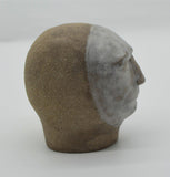 Sally Fitchard's 'Mr Silver'. A small ceramic head with a white face. RIGHT PROFILE