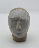 Sally Fitchard's 'Mr Silver'. A small ceramic head with a white face. FRONT FACING