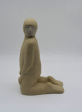 Side profile of one kneeling figure as part of Sally Fitchard's 'Multiple Kneels (Telling)'. 