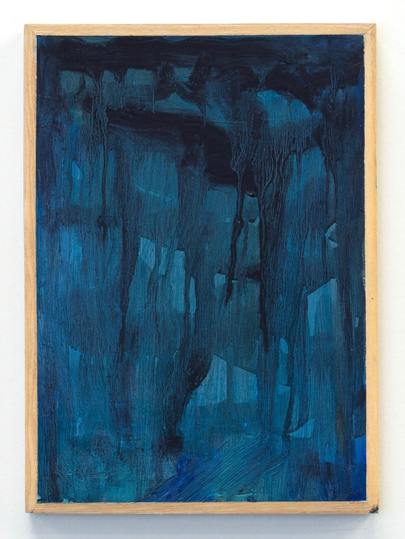 Abstract blue painting in a wooden frame on a white background