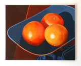 Marcus Bolt's artistic depiction of three oranges on blue scales with a dark background, mounted on a white wall.
