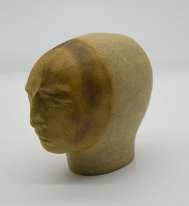 Sally Fitchard's 'Sienna'. A small ceramic head with a sienna face. RIGHT PROFILE I