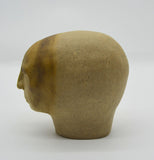 Sally Fitchard's 'Sienna'. A small ceramic head with a sienna face. RIGHT PROFILE II
