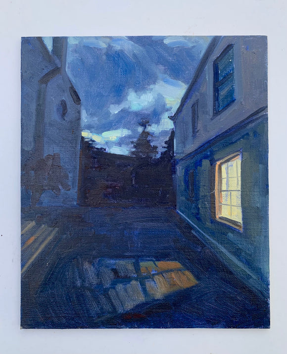 MOUNTED WORK Stacey Gledhill's 'Small Magic' is an oil painting on linen board. Painterly, the picture is of a lit window casting light onto the ground outside. Blue shades suggest dusk.