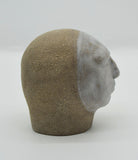 Sally Fitchard's 'Tommy' a small ceramic head with a white face. RIGHT PROFILE