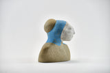 Title: Angelic Artist: Sally Fitchard Medium: clay bust sculpture Size: 13.5 cm x 11.6 cm x 7.4 cm (side II)
