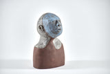 Title: Little Blue Artist: Sally Fitchard Medium: clay sculpture Size: 17.8 cm x 9.7 cm x 6.5 cm (front view, right side). Colours comprise- light blue, terracotta, light grey