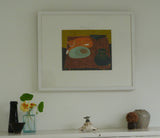 Photo of Fiona MacRae's 'Minoo' in situ. The artwork is framed in a wooden frame, which is painted white, and mounted in white