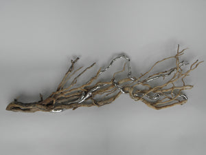 Title: The Track of My Tears Artist: Lucy Gray Medium: Wood, water gilded and burnished palladium leaf Size: 40 H x 155 W x 7 D cm. A mixed-media sculpture mounted on a wall. 